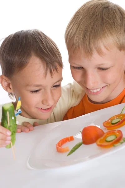 Beautiful boys holding a plate — Stock Photo, Image