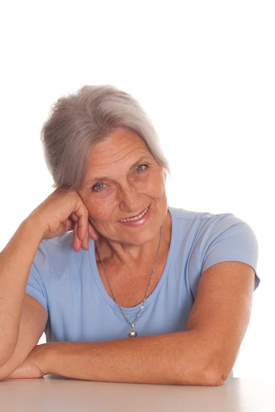 Beautiful older woman in blue — Stock Photo, Image