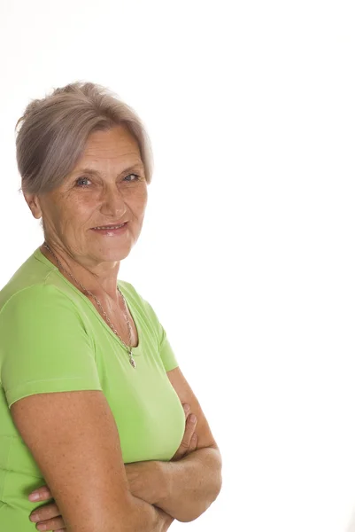 Beautiful older woman in green — Stock Photo, Image