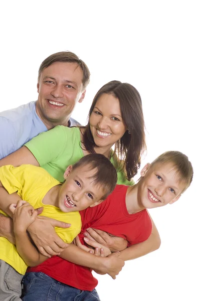La familia feliz en la ropa de color — Foto de Stock