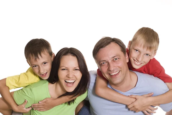 Família feliz em uma roupa a cores — Fotografia de Stock