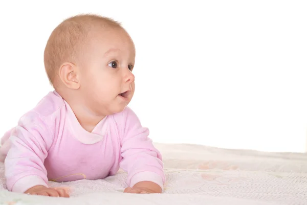 Glückliches Baby auf einem weißen — Stockfoto