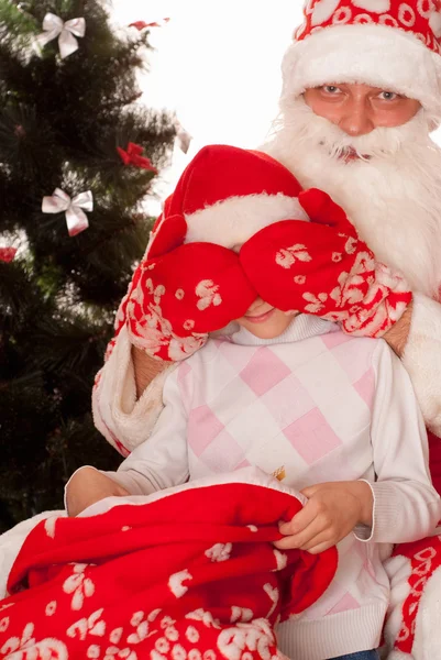 Santa gives presents to child — Stock Photo, Image