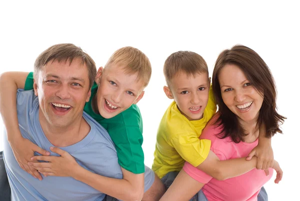La familia feliz en la ropa de color —  Fotos de Stock