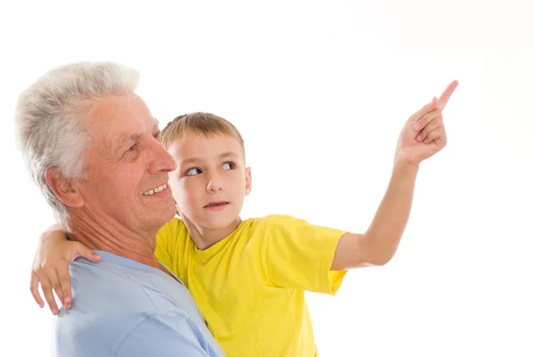 Morfar håller sin sonson Stockbild