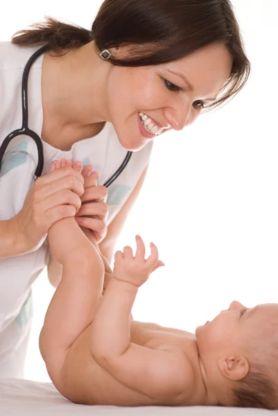 Doctor with newborn child Royalty Free Stock Images