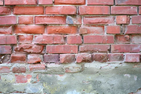 Weathered manchado velho tijolo vermelho parede fundo — Fotografia de Stock