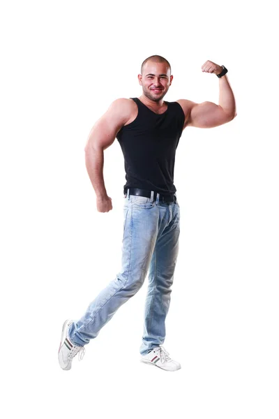 Silný muž ukazuje svaly — Stock fotografie
