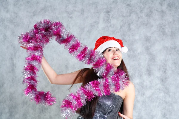 Young sexy Santa indress on grey — Stock Photo, Image