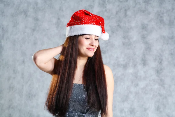 Young sexy Santa indress on grey — Stock Photo, Image