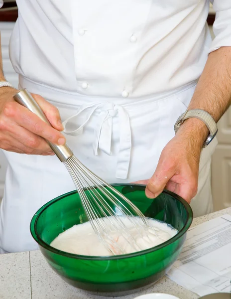 Professional chef hands with kitchen utensils whisk — Stock Photo, Image