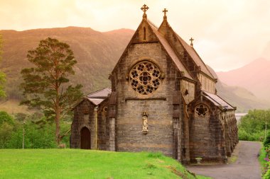 ST. Mary and St.Finnan Church It is located area of the Highlan clipart