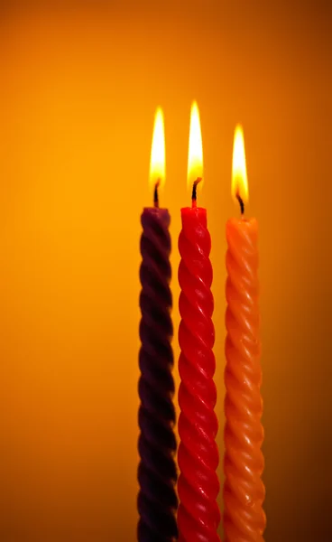 Three Candles On Yellow — Stock Photo, Image