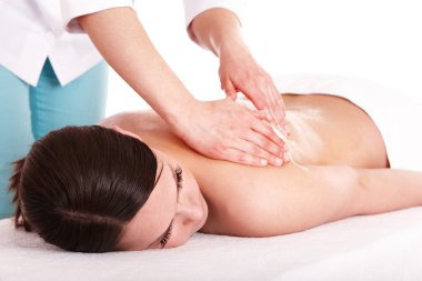 Young woman having massage. clipart