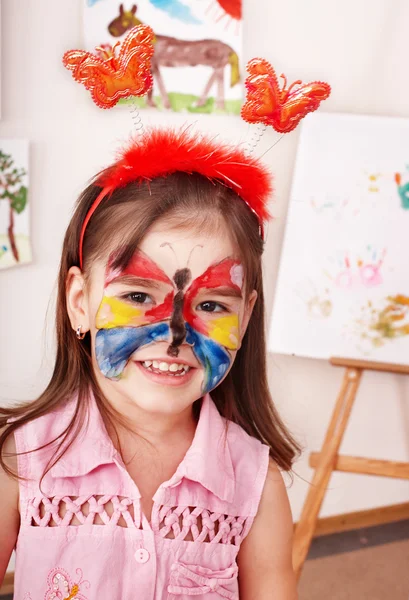 Child with paint of face. — Stock Photo, Image