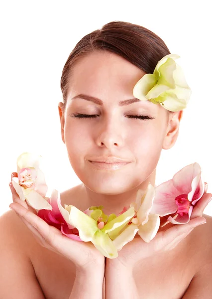 Beautiful girl with flower in spa. — Stock Photo, Image