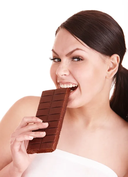 Gyönyörű lány harapás a csokoládé. — Stock Fotó