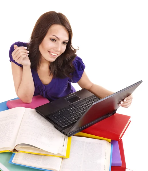 Menina com pilha de livro de cores e laptop . — Fotografia de Stock