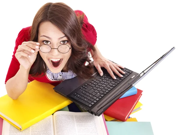 Menina com pilha de livro de cores e laptop . — Fotografia de Stock