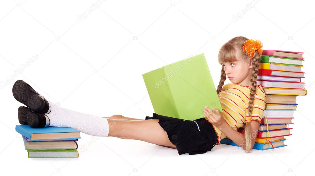 Schoolgirl reading stack of books.