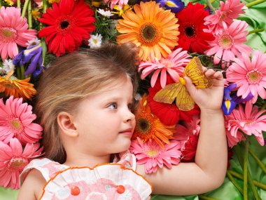 Cute child lying on the flower. clipart