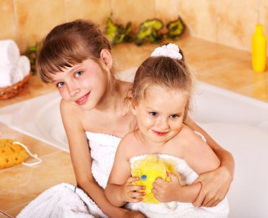 Kids washing in bath. clipart