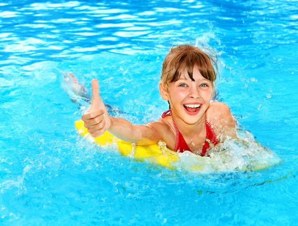 Kid on inflatable ring thumb up. — Stock Photo, Image