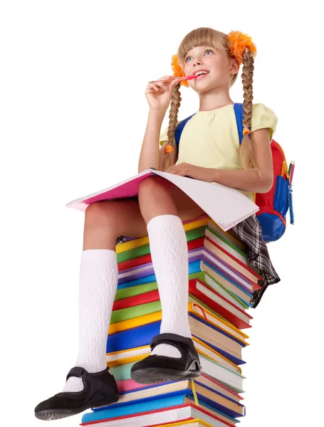 Estudante sentado em pilha de livros . — Fotografia de Stock