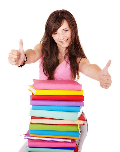 Dívka s knihou hromadu ukazuje palec. — Stock fotografie