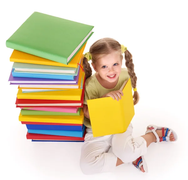 Child reading pile of books. Stock Picture