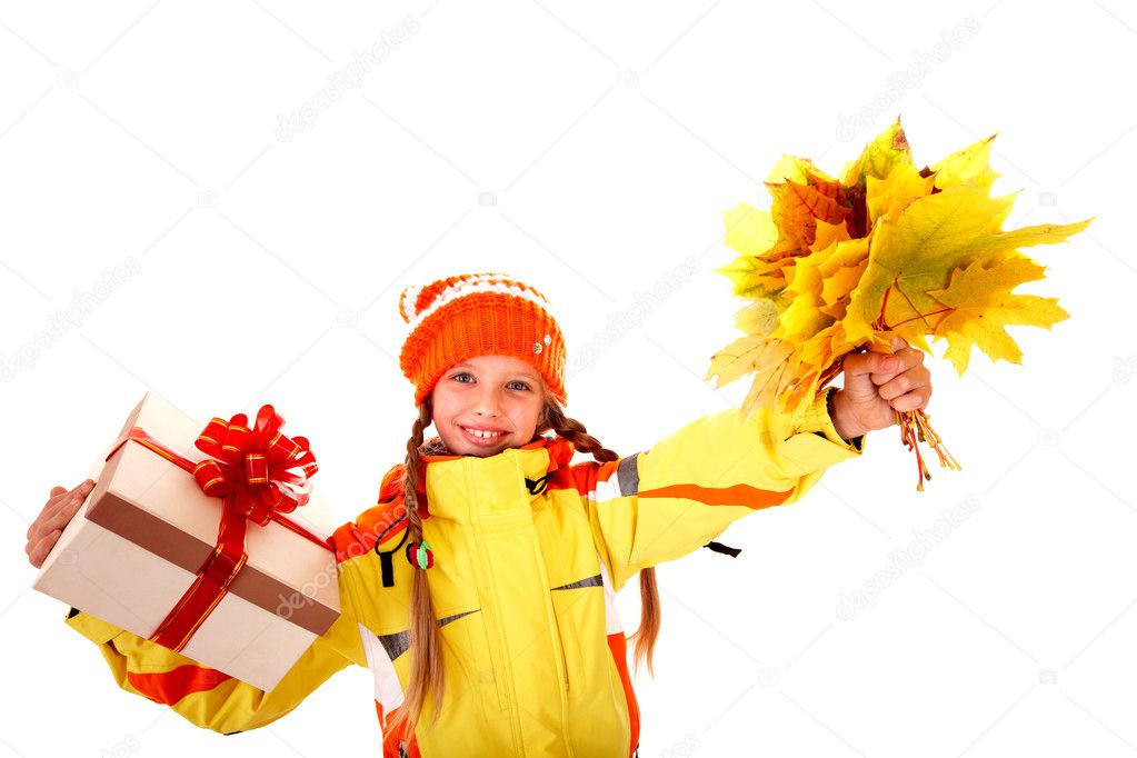 Child holding orange leaves and gift box.