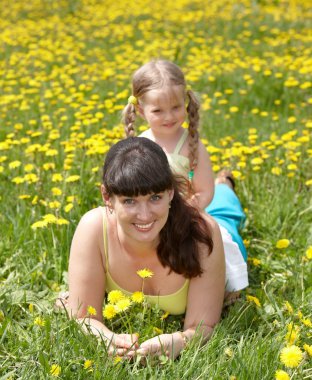 Mother with daughter in outdoor. clipart