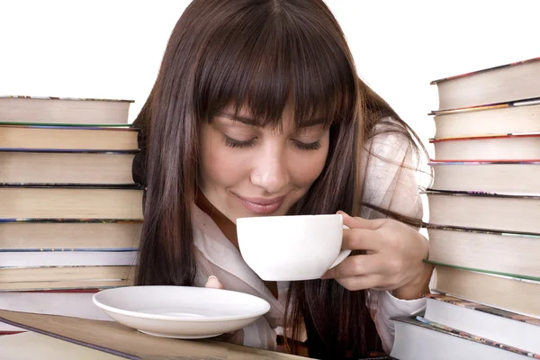 Meisje met heap boek en cup. — Stockfoto