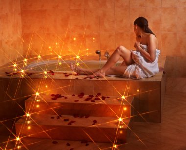 Woman relaxing in bath. clipart