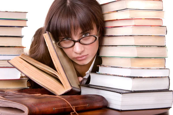 Chica inteligente con un montón de libros . — Foto de Stock