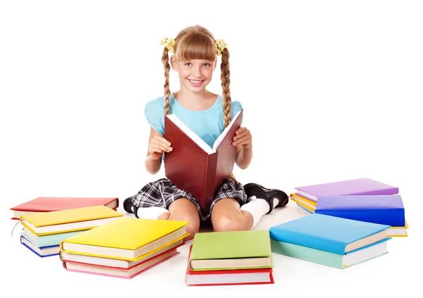 Child with pile of books reading on floor. — Stock Photo, Image