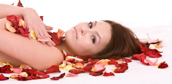 Girl in rose petal. Spa resort. — Stock Photo, Image