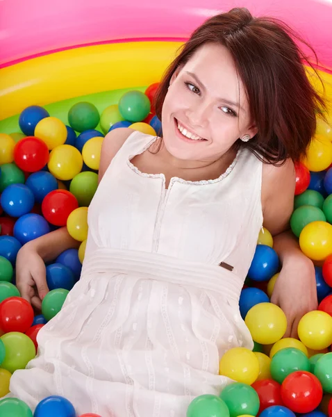 Happy birthday of girl in color ball on playground. — Stock Photo, Image