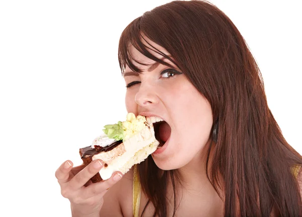 Ansikte flicka äter tårta. — Stockfoto