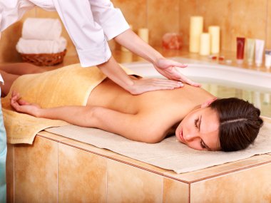 Massage of woman in beauty spa. clipart