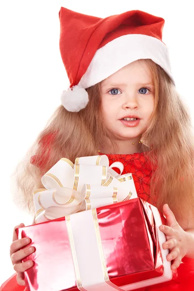 Child in red santa hat holding gift box. — Stock Photo, Image