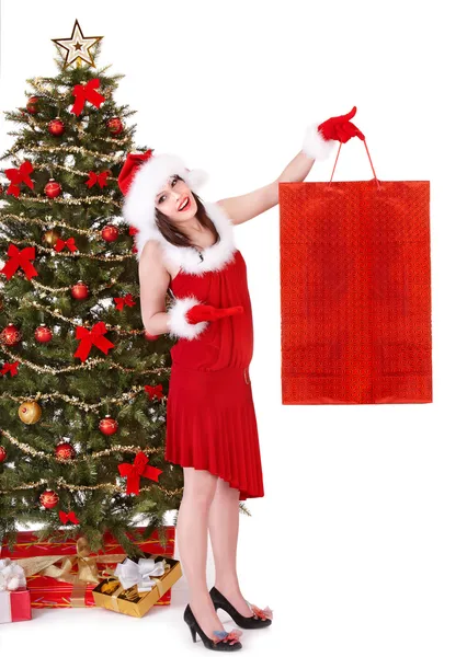 Meisje in Kerstman hoed, bedrijf boodschappentas, — Stockfoto