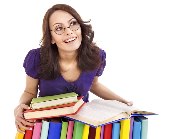 Dziewczyna w okularach z książki stosu . — Zdjęcie stockowe