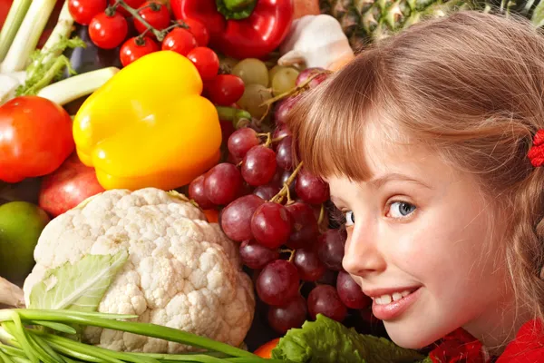 Child girl with group of vegetable and fruit. — Stock Photo, Image