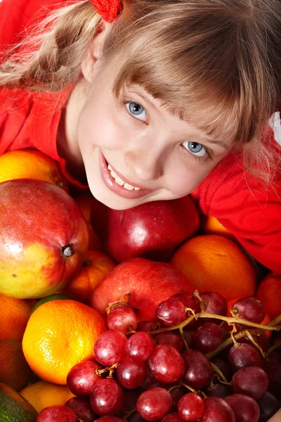 Child girl in group of fruit. — Stock Photo, Image