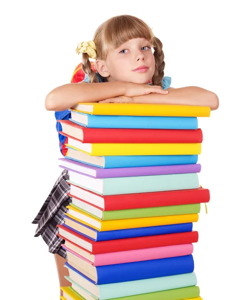 Schoolmeisje met rugzak bedrijf stapel boeken. — Stockfoto