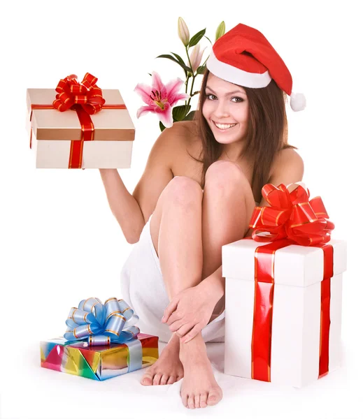 Christmas girl in santa hat, flower, gift box in spa. — Stock Photo, Image