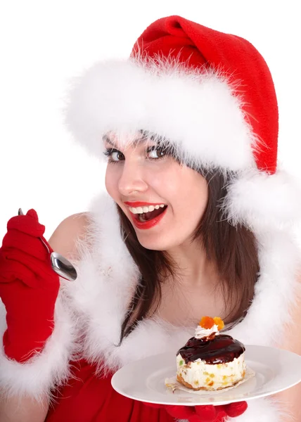 Ragazza di Natale in cappello di Babbo Natale e torta sul piatto . — Foto Stock