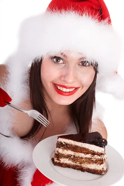 在圣诞老人帽子圣诞女孩吃蛋糕 . — 图库照片