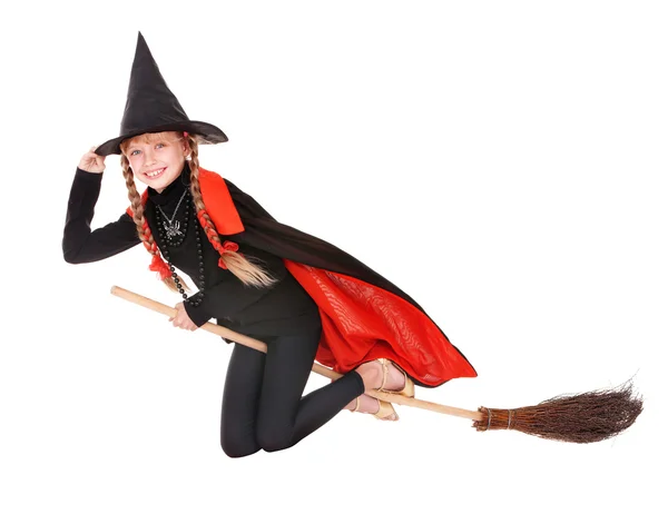 子供の衣装でハロウィーンの魔女のほうきで飛ぶ. — ストック写真